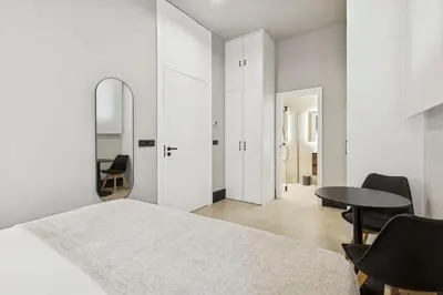 Cama o camas de una habitación en Elegant 2BR Apartment in Conde Duque