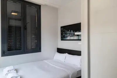 Cama o camas de una habitación en Rooms Centro de Madrid