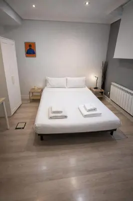 Cama o camas de una habitación en Rooms Centro de Madrid