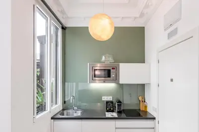 Una cocina o zona de cocina en Home Suite Home Gran Via, en pleno centro