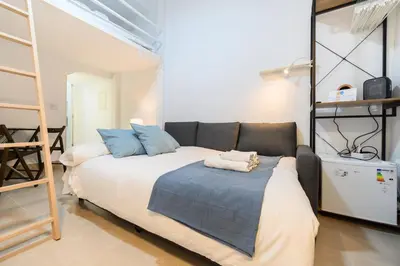 Cama o camas de una habitación en IRI70 - Acogedor Dúplex en el barrio Salamanca - Alquiler temporal