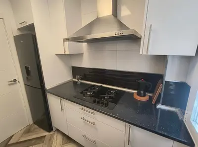 Una cocina o zona de cocina en Para familias o grupo de amigos - BARRIO DE LAS LETRAS - MADRID CENTRO
