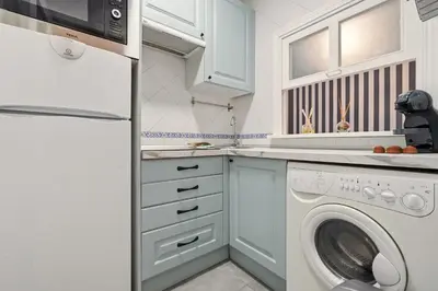 Una cocina o zona de cocina en Gran Via Best Apartment