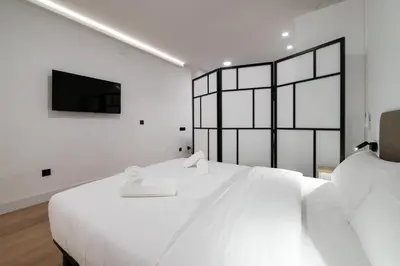 Cama o camas de una habitación en New Designer Studio Madrid - Next to Casa de Campo