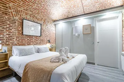 Cama o camas de una habitación en Bonito estudio Palacio Real