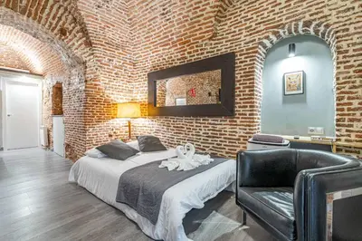 Cama o camas de una habitación en Bonito estudio Palacio Real