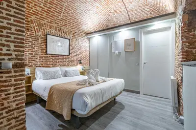Cama o camas de una habitación en Bonito estudio Palacio Real