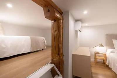 Cama o camas de una habitación en Charming City-Center Duplex in Madrid