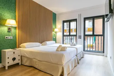 Cama o camas de una habitación en Apartahotel Quo Eraso