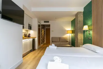 Cama o camas de una habitación en Apartahotel Quo Eraso
