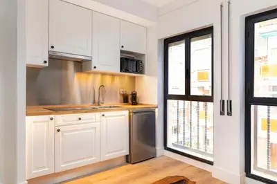 Una cocina o zona de cocina en Apartahotel Quo Eraso