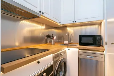 Una cocina o zona de cocina en Apartahotel Quo Eraso