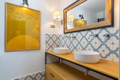 Un baño de Apartahotel Quo Eraso