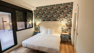 Cama o camas de una habitación en Apartahotel Quo Eraso