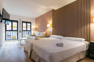Cama o camas de una habitación en Apartahotel Quo Eraso