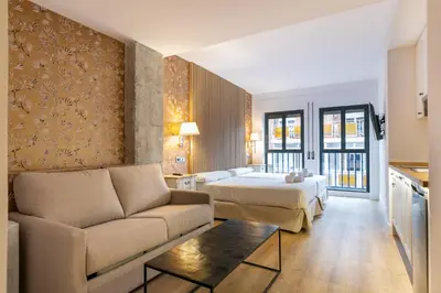 Cama o camas de una habitación en Apartahotel Quo Eraso