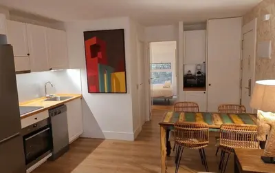 Una cocina o zona de cocina en Apartahotel Quo Eraso
