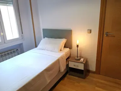 Cama o camas de una habitación en Amplio apartamento situado a 10 minutos del Retiro