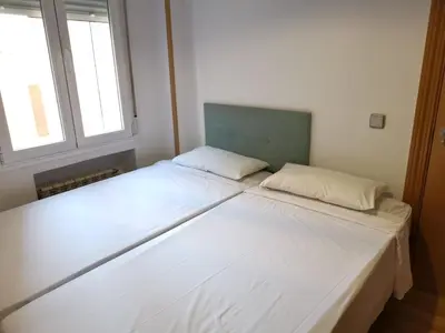 Cama o camas de una habitación en Amplio apartamento situado a 10 minutos del Retiro
