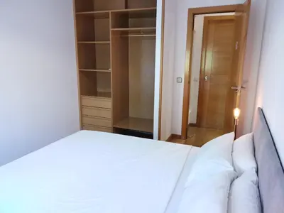 Cama o camas de una habitación en Amplio apartamento situado a 10 minutos del Retiro