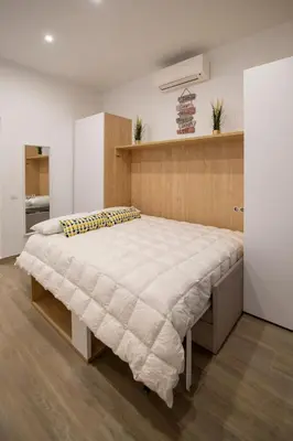 Cama o camas de una habitación en Cozy studio in Chamberí