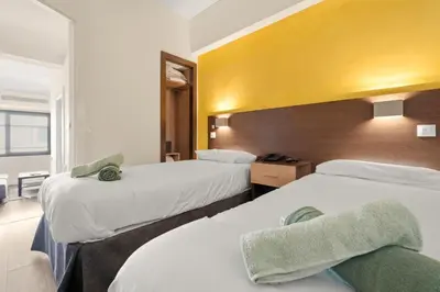 Cama o camas de una habitación en Apartamento reformado cerca del Retiro
