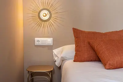 Cama o camas de una habitación en Queen's Puerta del Sol Boutique I - Alojamiento Corta Estancia