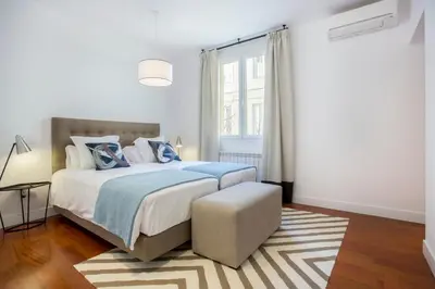 Cama o camas de una habitación en Slow Suites Augusto
