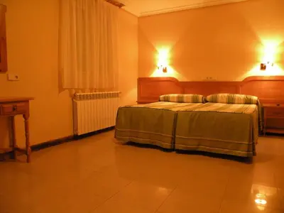 Cama o camas de una habitación en Hostal Benamar