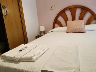 Cama o camas de una habitación en Hostal Abitum Madrid
