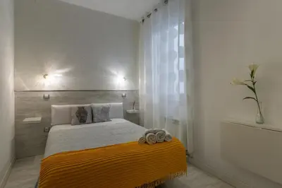 Cama o camas de una habitación en Hostal Met Madrid
