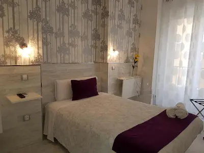 Cama o camas de una habitación en Hostal Met Madrid