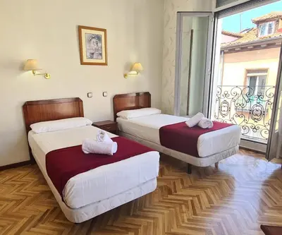 Cama o camas de una habitación en Hostal Sardinero