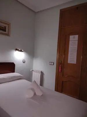 Cama o camas de una habitación en Hostal Sardinero