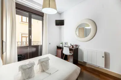 Cama o camas de una habitación en Madrid House Rooms