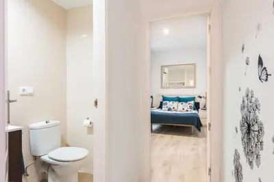 Cama o camas de una habitación en Atocha apartamentos zona Centro