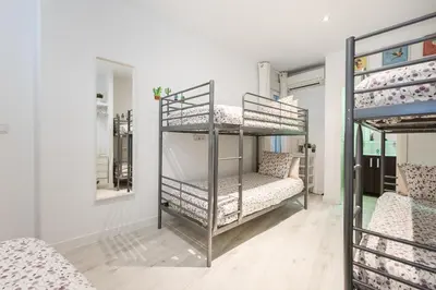 Cama o camas de una habitación en Atocha apartamentos zona Centro