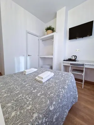 Cama o camas de una habitación en Hostal A Nuestra Senora de La Paloma