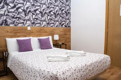 Cama o camas de una habitación en Hostal Abel Victoriano