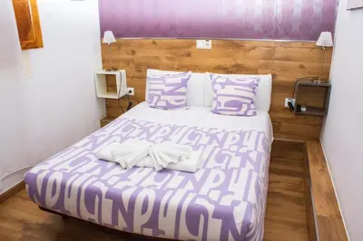 Cama o camas de una habitación en Hostal Abel Victoriano