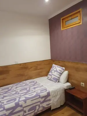 Cama o camas de una habitación en Hostal Abel Victoriano