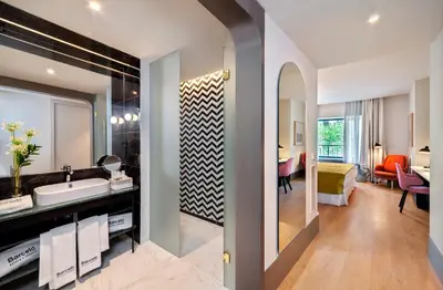 Cama o camas de una habitación en Barceló Torre de Madrid
