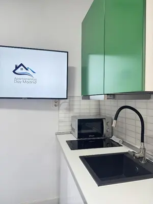 Una cocina o zona de cocina en Apartamentos Day Madrid GRAN VIA I