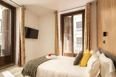 Cama o camas de una habitación en Apartamentos Day Madrid GRAN VIA I