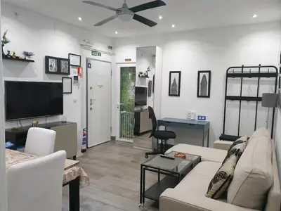Una televisión o centro de entretenimiento en Serenity Place Tirso Molina