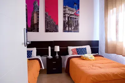 Cama o camas de una habitación en Reina Victoria Apartaments & SuiteS TPH