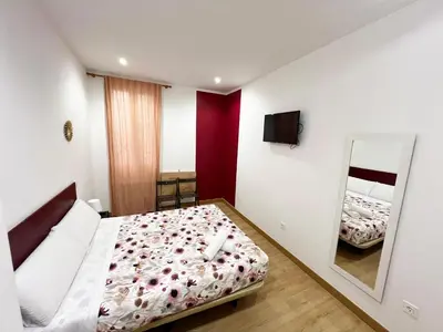 Cama o camas de una habitación en Hostal Abaaly