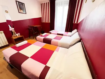 Cama o camas de una habitación en Hostal La Casa de La Plaza