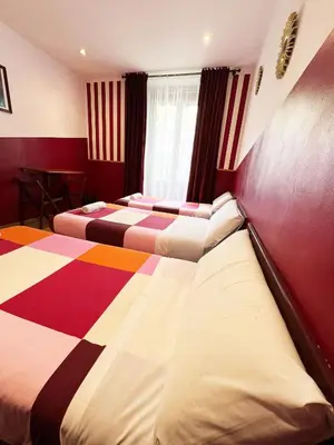 Cama o camas de una habitación en Hostal La Casa de La Plaza