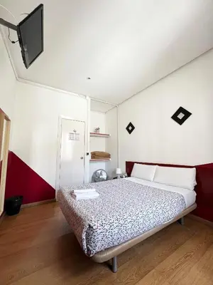 Cama o camas de una habitación en Hostal La Casa de La Plaza